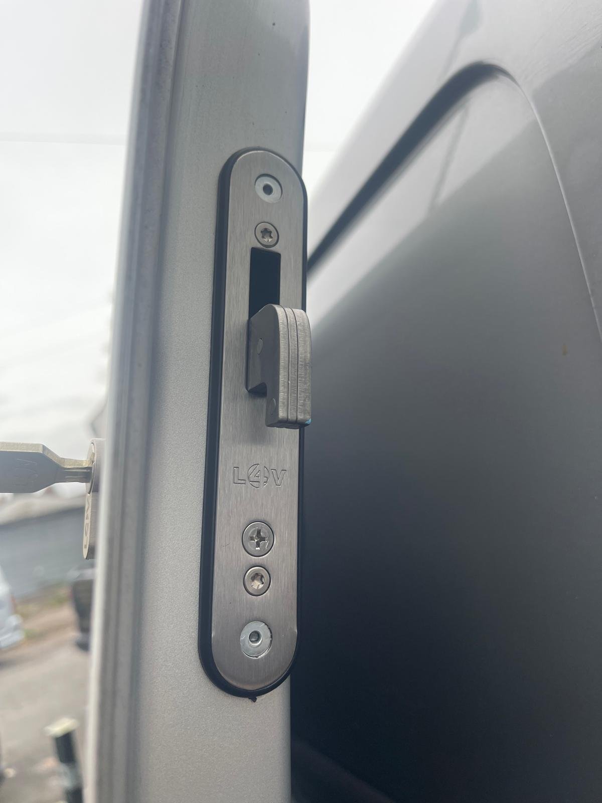 Hook deadlock fitted to a van door edge